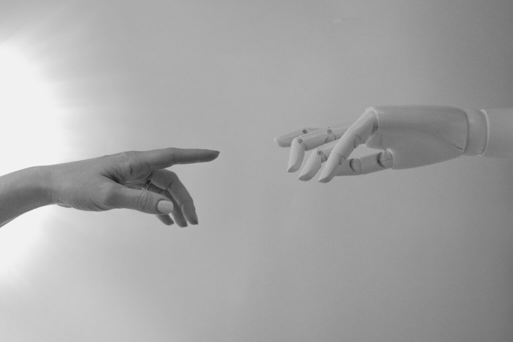 Robotic and human hands meeting